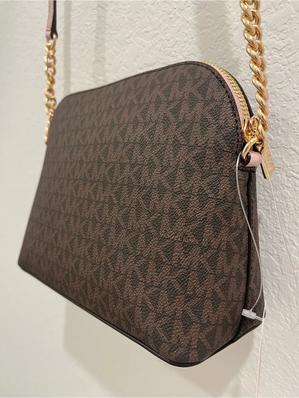 Michael Kors Brown Monogram Crossbody with Pink Trim and Gold Chain Brand new .
